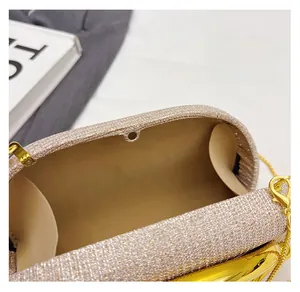 Detailed view of the luxury champagne gold evening bag with high-quality magnetic buckle closure
