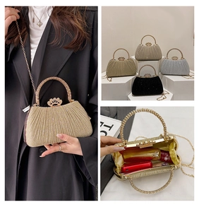 Detail of glitter evening clutch showing crystal handle and four color options