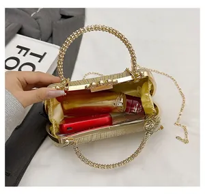 Interior view of golden glitter clutch showing capacity for phone and cosmetics