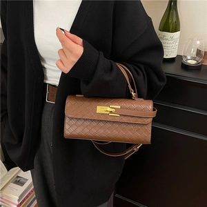 Elegant brown woven leather handbag with gold clasp and detachable shoulder strap