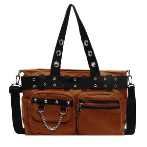 Brown corduroy tote bag with punk metal rivets and chain details on a white background