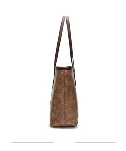 Side view of vintage brown embossed leather tote bag showing spacious interior and texture