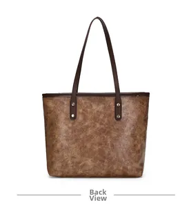 Back view of brown vintage tote bag with marble texture and golden rivet details