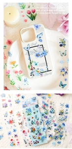 Details von Blumen- und Schmetterlingsaufklebern auf einer Handyhülle im Vintage-Stil