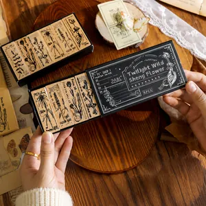 Set of 6 vintage wooden floral stamps in an elegant black slide-out gift box