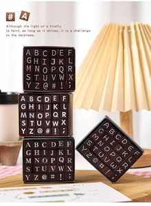 Close-up of vintage wooden alphabet stamps set with upper case letters in a storage box