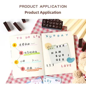 Creative wooden alphabet stamp set used on a DIY planner page with decorative stickers