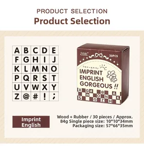 Detail view of 30-piece vintage wooden alphabet stamp set with rubber finish in a box