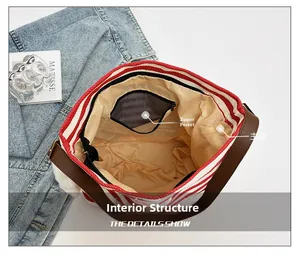 Internal view showing zipper pocket and large main compartment of striped canvas tote