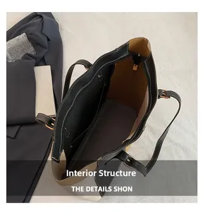Internal structure of bicolor tote bag showing large main compartment and zipper pocket