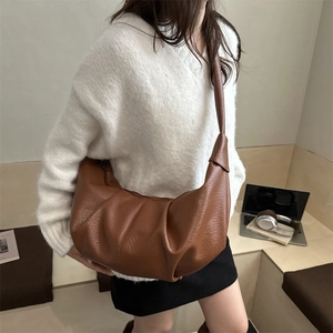 Brown vintage soft leather slouchy dumpling bag with pleated texture and wide strap