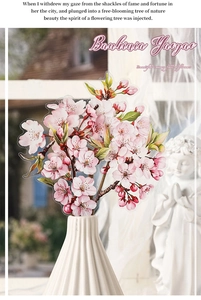 Detailed view of Bauhinia Yaoyao floral stickers on a white vase in a garden setting