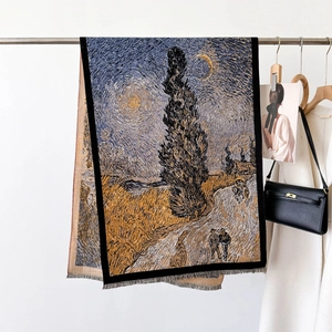 Van Gogh style oil painting scarf with tassels on display in a luxury boutique setting