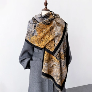 Artistic oil painting scarf with Van Gogh style pattern and fringe on a gray coat