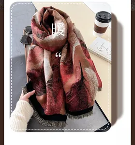Detailed view of thick oil painting feather pattern scarf with tassel trim edges