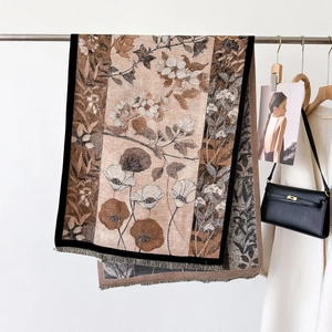 Elegant floral thick warm scarf with fringe detail shown in a fashion outfit setting