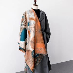 Elegant floral print shawl wrap with fringe details over a wool coat for autumn winter