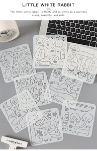 Detailed view of white hollowed-out animal painting templates on a stationery background