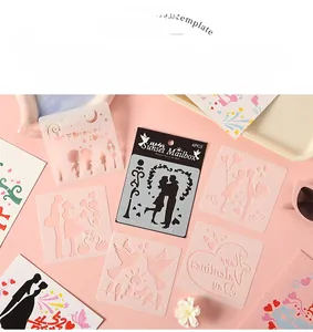 Close-up of 6-piece PET stencil set with romantic heart and couple silhouette patterns
