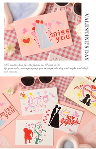 Detail view of Valentine's DIY stencil art on pink paper with heart and couple motifs