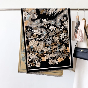 Thick floral jacquard scarf with phoenix motifs and short fringe on a black background