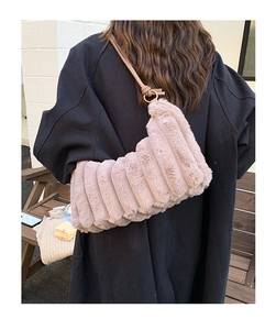 Plush tote bag in dusty pink with vertical stripe texture and leather knotted straps
