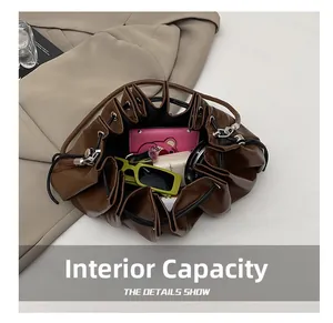 Top view of deep brown bucket bag interior showing large capacity for daily essentials