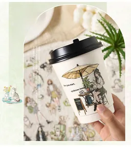 Close-up of decorative PET stickers with girl and plant motifs on a white paper cup