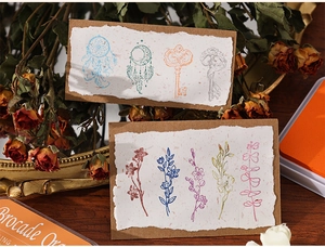 Detailed close-up of retro aesthetic craft cards with floral and dreamcatcher patterns