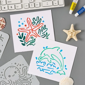 Reusable ocean themed PET painting stencils with dolphin and starfish cutout patterns