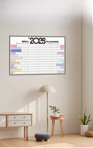 Modern wall 2025 planner calendar displayed in a minimalist home office setting