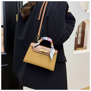 Brown leather and wool texture crossbody bag with silk scarf detail on handle