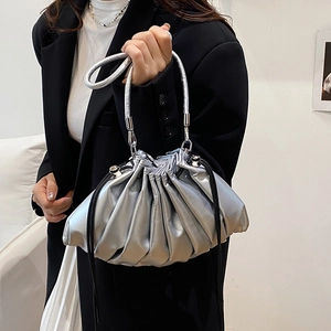 Silver metallic pleated bucket bag with drawstring closure and circular handle for women