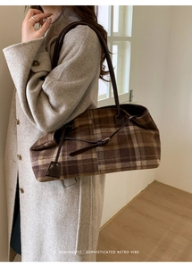 Detail of vintage brown plaid wool tote bag showing texture and long shoulder strap