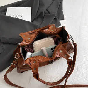 Internal view showing large capacity for essentials in brown vintage studded bag