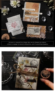 Detail showing vintage wooden stamps with celestial engravings and floral collage cards