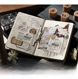 Close-up of vintage flower and starry sky wooden stamps used for journal decorating
