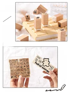 Close-up of 36-piece beech wood stamp set with cute cartoon bears and lifestyle icons