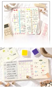 Close-up of wooden stamp set with cute icons and colorful ink pads for DIY planners