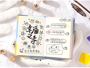 Detailed view of wood stamp set on decorative A5 planner with hand-drawn layouts