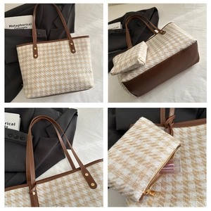 Detail of houndstooth tote set with leather trim and matching small zipper pouch