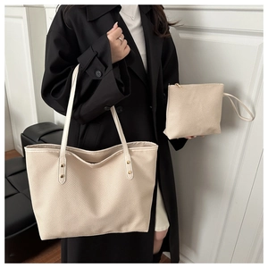 Beige textured tote bag set with matching pouch and golden stud details on shoulder straps