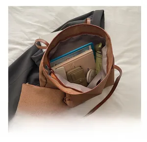 Detail of brown woven tote bag set showing large capacity for tablet and daily items