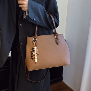Brown vintage textured tote bag with beaded tassel, stylish large capacity commuter handbag