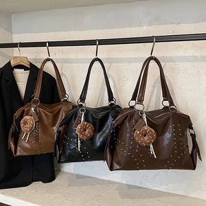 Chic rivet tote bags in brown and black with donut charms for stylish women