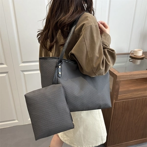 Fashionable grey textured tote bag set with matching pouch and stylish shoulder straps