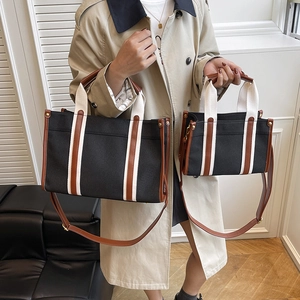 Fashion canvas tote bag in black and brown with adjustable strap in two sizes