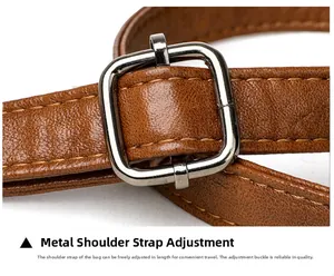 Detail of brown litchi pattern leather shoulder strap with silver adjustable buckle