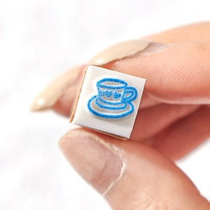 Mini wooden stamp featuring a blue coffee cup design with a small heart for DIY journaling