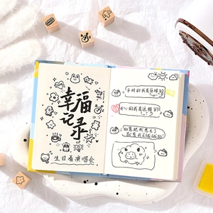 Artistic wooden stamps and ink pad on creative journaling pages with hand-drawn illustrations